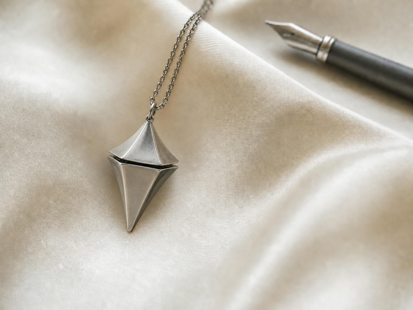 Concept macro study of the geometry-correct titanium Glimmer pendant